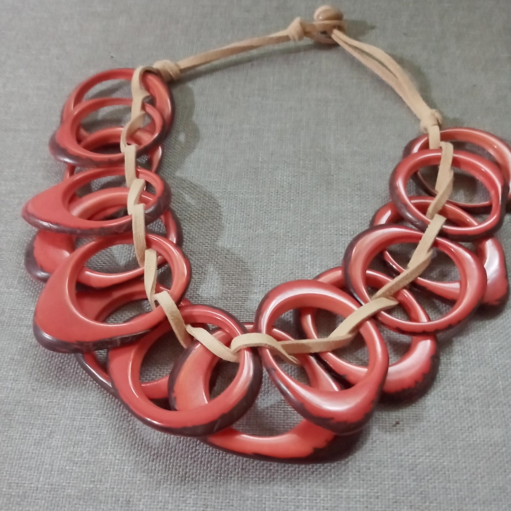 Modern coral colored with tan leather long choker